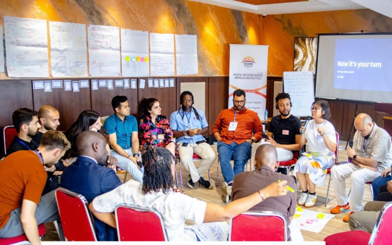 Participants seated in a circle during a workshop session.